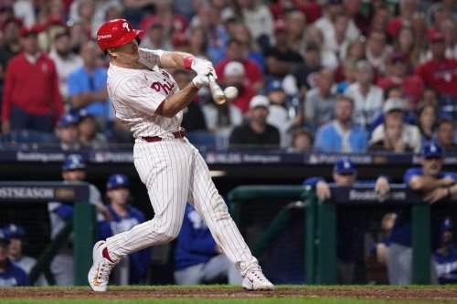 FILE - Philadelphia Phillies' J.T. Realmuto hits a double during the ninth inning in Game 2 of baseball's National League Division Series against the Los Angeles Dodgers, Monday, Oct. 6, 2025, in Philadelphia. (AP Photo/Matt Slocum, File)