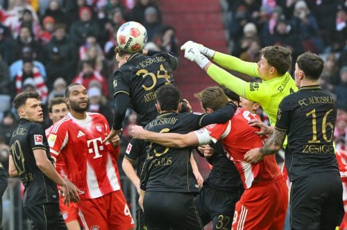 Augsburg's goalkeeper Finn Dahmen in action during the German Bundesliga soccer match between Bayern Munich and FC Augsburg in Munich, Saturday, Jan. 24, 2026. (Peter Kneffel/dpa via AP)