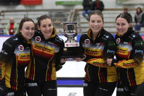 Kelsey Calvert, from left, Beth Peterson, Katherine Remillard and Melissa Gordon-Kurz hoist Manitoba&rsquo;s women&rsquo;s curling championship trophy in Rivers on Sunday. (Thomas Friesen/The Brandon Sun)