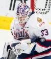 Regina Pats goaltender Max Paddock stops a shot from an Acadie-Bathurst Titan shooter during the Memorial Cup final in Regina on May 20, 2018. (The Canadian Press)