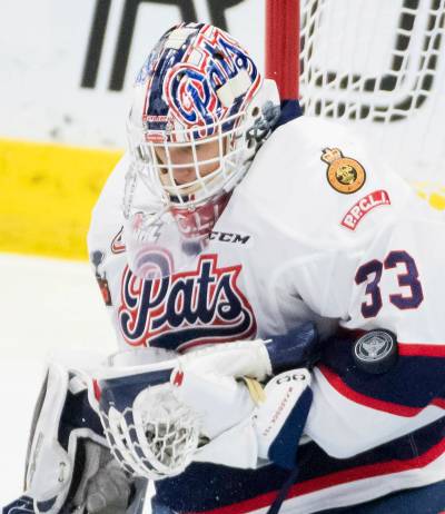 Regina Pats goaltender Max Paddock stops a shot from an Acadie-Bathurst Titan shooter during the Memorial Cup final in Regina on May 20, 2018. (The Canadian Press)