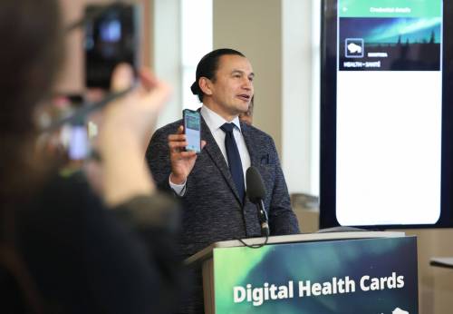 Premier Wab Kinew and Health, Seniors and Long-Term Care Minister Uzoma Asagwara announce the New Digital Health Card for Manitobans at a news conference in Winnipeg on Monday. (Ruth Bonneville/Winnipeg Free Press)