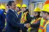 Premier Wab Kinew greets workers before a press conference on the Manitoba Jobs Agreement in Winnipeg on Monday. (Mike Deal/Winnipeg Free Press)