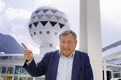 FILE - Erich von Daeniken, co-founder and co-owner of Mystery Park, poses in front of the Panorama Tower at Mystery Park in Interlaken, Wednesday, April 23, 2003. (Gaetan Ball)/Keystone via AP, File)
