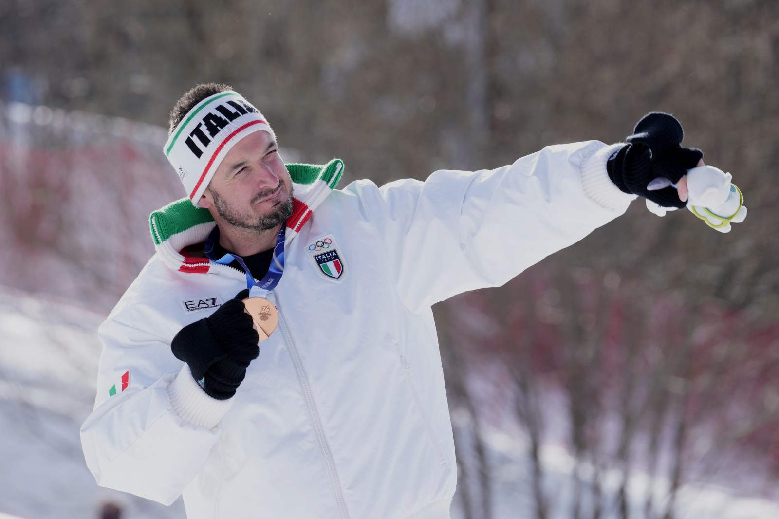 Heavy medal: Downhill bronze winner Dominik Paris of Italy sings in a rock band when not ski racing