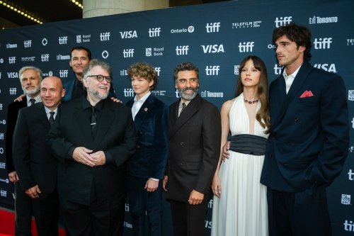 Christoph Waltz, left to right, producer J. Miles Dale, producer Scott Stuber, Guillermo Del Toro, Christian Convery, Oscar Isaac, Mia Goth and Jacob Elordo pose for a group photo on the red carpet for 