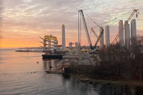 Blades and turbine bases for offshore wind sit at a staging area at New London State Pier, Wednesday, Jan. 14, 2026, in New London, Conn. (AP Photo/Matt O'Brien)