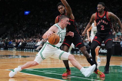 Boston Celtics guard Payton Pritchard (11) drives to the basket against the Toronto Raptors during the second half of an NBA basketball game, Friday, Jan. 9, 2026, in Boston. (AP Photo/Charles Krupa)