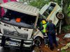 In this photo provided by ALS Paramedics on Thursday, Jan. 29, 2026, rescue personnel inspect the site of a collision involving a minibus taxi and a truck, near Durban, South Africa. (ALS Paramedics via AP Photo)