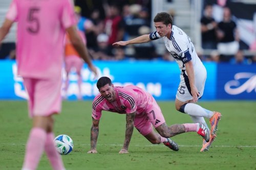 Inter Miami's Rodrigo de Paul (7) is taken down by Vancouver Whitecaps' Ryan Gauld (25) during the second half of the MLS Cup final soccer match, in Fort Lauderdale, Fla., on Saturday, December 6, 2025. THE CANADIAN PRESS/Darryl Dyck