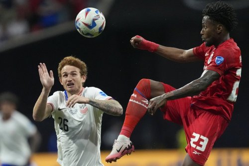 Panama's Michael Murillo, right, jumps for a ball challenged by Josh Sargent of the United States during a Copa America Group C soccer match in Atlanta, Thursday, June 27, 2024. (AP Photo/Mike Stewart)