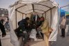 Palestinians mourn over the body of a person who was killed in an Israeli strike, as they sit on a cart during his funeral outside at Al-Aqsa Hospital in Deir al-Balah, central Gaza Strip, Friday, Jan. 30, 2026. (AP Photo/Abdel Kareem Hana)