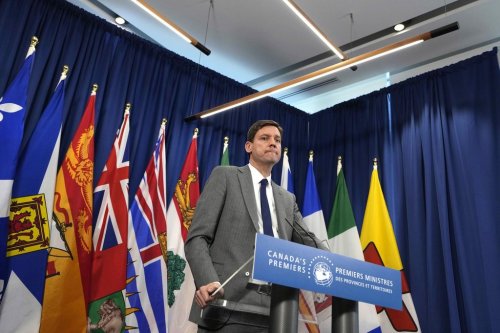 Premier of British Columbia David Eby takes questions after meeting with Canadian premiers at a Council of the Federation meeting in Ottawa on Wednesday, Jan. 28, 2026. THE CANADIAN PRESS/Justin Tang