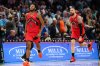 Toronto Raptors guard Immanuel Quickley (5) and Toronto Raptors forward/centre Sandro Mamukelashvili (54) celebrate against the Charlotte Hornets during the second half of an NBA basketball game on Wednesday, Jan. 7, 2026, in Charlotte, N.C. (AP Photo/Krista Jasso)