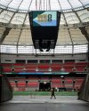 A worker walks across a tunnel at B.C. Place during a FIFA World Cup 2026 update in Vancouver, Tuesday, April 30, 2024. THE CANADIAN PRESS/Ethan Cairns