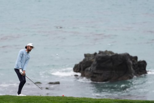 Akshay Bhatia putts to the eighth green at Pebble Beach Golf Links during the third round of the AT&T Pebble Beach Pro-Am golf tournament, Saturday, Feb. 14, 2026, in Pebble Beach, Calif. (AP Photo/Godofredo A. Vásquez)