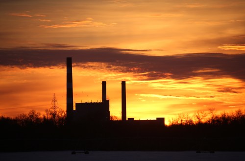 The Manitoba Hydro Brandon generating station off Victoria Avenue East is silhouetted against a colourful sky just before sunrise. (Matt Goerzen/The Brandon Sun files)