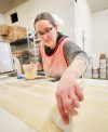 Victoria Pichie, baker and daughter of Henry Meats owner Norman Henry brushes egg wash a sheet of dough while making sausage rolls on Wednesday afternoon for the Westman Multicultural Festival’s Scottish pavilion, which opens on Friday evening. Henry Meats has been involved in food preparation for Brandon’s Scottish pavilion since the festival began. (Matt Goerzen/The Brandon Sun)