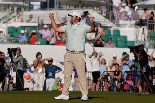 Chris Gotterup celebrates his win after sinking a birdie putt on the first playoff hole at the 18th green during the final round of the Phoenix Open golf tournament Sunday, Feb. 8, 2026, in Scottsdale, Ariz. (AP Photo/Ross D. Franklin)