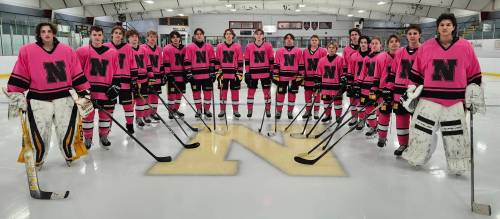 The Neepawa Tigers pose in their pink jerseys prior to their Cancer Care fundraising match against the Minnedosa/Erickson Chancellors which is set for next Friday at the Yellowhead Community Recreation Centre. Neepawa is hoping to best its $5700 donation totals set last year. (Submitted)
                                against the visiting Virden Golden Bears on Jan. 27 at the Yellowhead Centre. The team raised an incredible $5,400 that night for local use in the battle against cancer. (Submitted)(Submitted)
