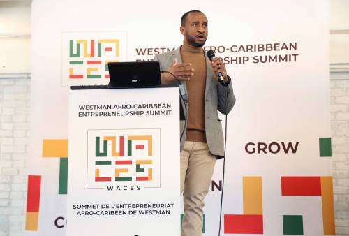 Emelio Brown, convenor of the Westman Afro-Caribbean Entrepreneur Summit, speaks during the summit at The Firehall Event Venue in Brandon on Friday afternoon. (Tim Smith/The Brandon Sun)