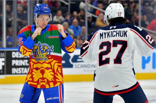 Ryan Gower (32) of the Edmonton Oil Kings, left, squares off against Tri-City Americans forward Mason Mykichuk (27) on Jan. 17. Gower takes pride in doing whatever is needed to help his team. (LA Media/Edmonton Oil Kings)