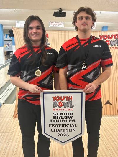 Darius Corrigal (left) and Jordan Penner (right) pose after capturing the senior hi/low doubles provincial championship in Winnipeg last year. (Submitted)