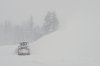 A road is cleared during a snow storm on Wednesday, Feb. 18, 2026 near Soda Springs, Calif. (AP Photo/Brooke Hess-Homeier)