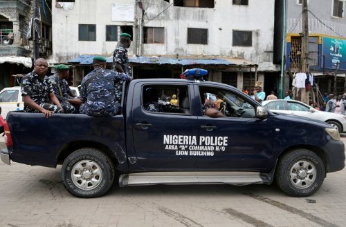FILE - Police officers patrol during the gubernatorial and state Assembly elections in Lagos, Nigeria, Saturday, March 18, 2023. (AP Photo/Sunday Alamba, file)