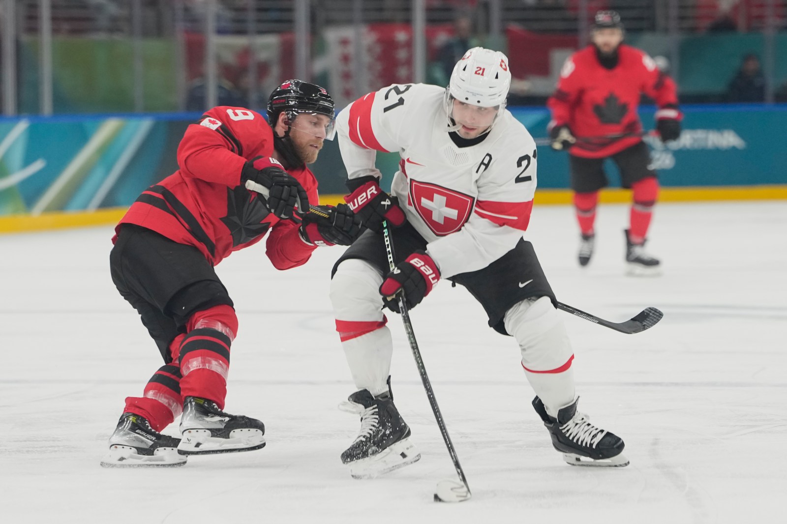 Switzerland forward Kevin Fiala taken off ice at Olympics on stretcher with leg injury
