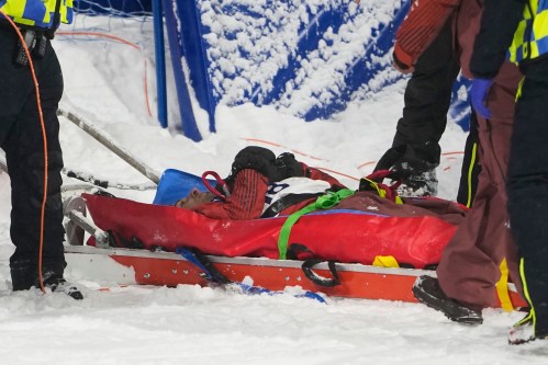 Medical personnel stretcher Canada's Mark McMorris off after crashing during a snowboard big air training session at the 2026 Winter Olympics, in Livigno, Italy, Wednesday, Feb. 4, 2026. (AP Photo/Lindsey Wasson)