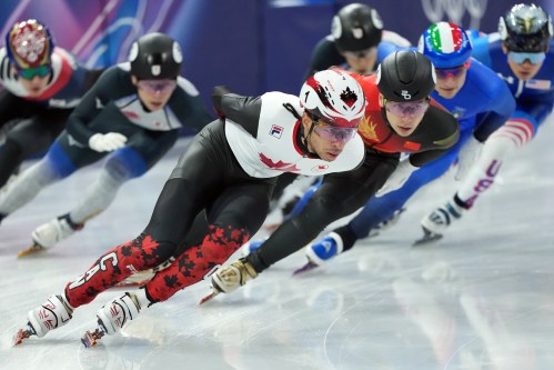 Canada's William Dandjinou competes in the Men's semifinal 1500m Short Track Speed Skating event during the 2026 Milan Cortina Winter Olympics in Milan, Italy on Saturday, February 14, 2026. THE CANADIAN PRESS/Nathan Denette