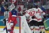 Team Canada players celebrate a power-play goal against Lukas Dostal (1) of Team Czechia during third period of men's Olympic hockey action at the 2026 Milan Cortina Winter Olympics in Milan, Italy on Thursday, Feb. 12, 2026. THE CANADIAN PRESS/Nathan Denette