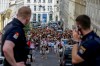 FILE - Austrian police officers watch swifts gathering in the city centre in Vienna on Aug.8, 2024. (AP Photo/Heinz-Peter Bader, file)
