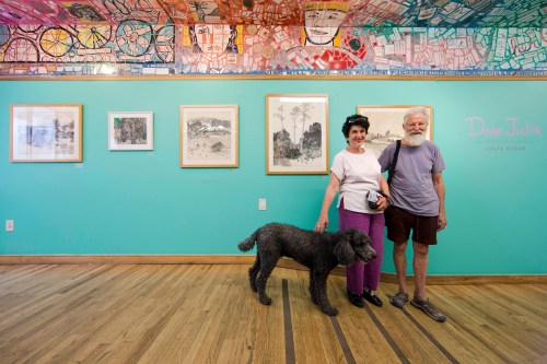 FILE - Julia Zagar, left, and her husband Isaiah Zagar pose for a photo with their dog Blue at the 
