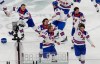 United States' Jack Hughes (86), right, celebrates with teammates after scoring the game winning goal against Canada in sudden death overtime during the men's ice hockey gold medal game at the 2026 Winter Olympics, in Milan, Italy, Sunday, Feb. 22, 2026. (AP Photo/Luca Bruno)