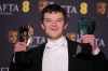 Robert Aramayo poses with the EE rising star award and the award for leading actor for 'I Swear' at the 79th British Academy Film Awards, BAFTA's, in London, Sunday, Feb. 22, 2026. (AP Photo/Alastair Grant)