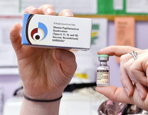 A nurse holds up a vial and box for the HPV vaccine, brand name Gardasil, at a clinic in Kinston, N.C. on Monday, March 5, 2012. (AP Photo/Daily Free Press, Charles Buchanan)