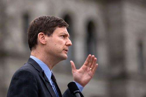 Premier David Eby is joined by fellow MLAs in solidarity as he speaks during a press conference following the throne speech while the province declares today as a day of mourning at the legislature in Victoria, B.C., on Thursday, Feb. 12, 2026. THE CANADIAN PRESS/Chad Hipolito