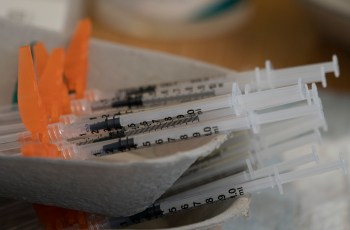 Needles are seen filled with the vaccination for COVID-19 at a truck stop along highway 91 North in Delta, B.C., Wednesday, June 16, 2021. THE CANADIAN PRESS/Jonathan Hayward