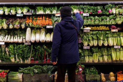 A customer shops for produce at a grocery store In Toronto on Friday, Feb. 2, 2024. THE CANADIAN PRESS/Cole Burston