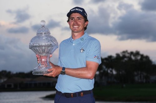Nico Echavarria of Colombia holds the Cognizant Classic Trophy at the end of the final round of the Cognizant Classic golf tournament, Sunday, March 1, 2026, in Palm Beach Gardens, Fla. (AP Photo/Marta Lavandier)