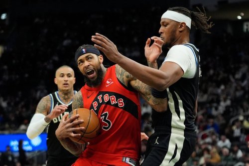 Toronto Raptors' Brandon Ingram, front left, drives to the basket against Milwaukee Bucks' Myles Turner, right, during the first half of an NBA basketball game Sunday, Feb. 22, 2026, in Milwaukee. (AP Photo/Aaron Gash)