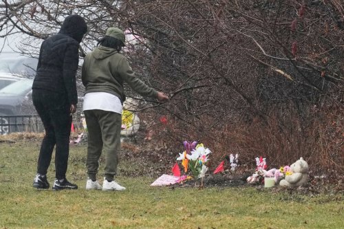 People visit a memorial at the site where two girls bodies were found earlier this week, in Cleveland, Thursday, March 5, 2026. (AP Photo/Sue Ogrocki)