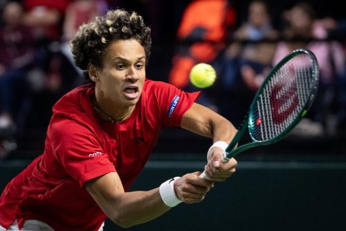 Canada's Gabriel Diallo returns to Brazil's Matheus Pucinelli de Almeida during the third set of a Davis Cup Qualifiers tennis singles match in Vancouver, on Saturday, Feb. 7, 2026. THE CANADIAN PRESS/Ethan Cairns