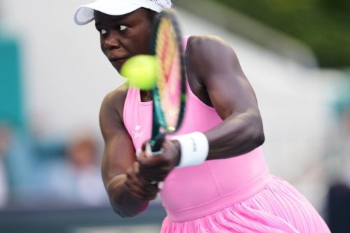 Victoria Mboko, of Canada, hits a return to Karolina Muchova, of the Czech Republic, during a quarterfinal match at the Miami Open tennis tournament, Tuesday, March 24, 2026, in Miami Gardens, Fla. (AP Photo/Jim Rassol)
