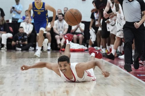 Toronto Raptors' Tyreke Key falls to the floor against the Golden State Warriors during the first half of a NBA summer league basketball game Thursday, July 17, 2025, in Las Vegas. (AP Photo/John Locher)