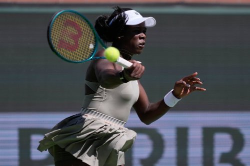 Victoria Mboko of Canada returns a shot against Aryna Sabalenka of Belarus during a quarterfinal match at the BNP Paribas Open tennis tournament on March 12, 2026, in Indian Wells, Calif. (AP Photo/Mark J. Terrill)