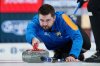 Team Dunstone skip Matt Dunstone throws a rock during Canadian Olympic curling trials finals action against Team Jacobs in Halifax on Saturday, Nov. 29, 2025. THE CANADIAN PRESS/Darren Calabrese