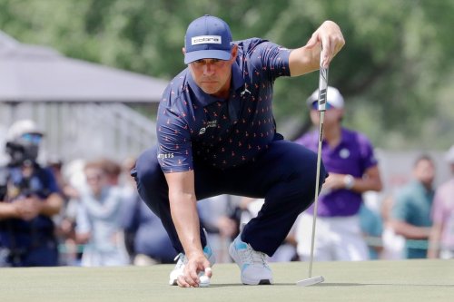 Gary Woodland places his ball on the ninth green during the final round of the Texas Children's Houston Open golf tournament Sunday, March 29, 2026, in Houston. (AP Photo/Michael Wyke)